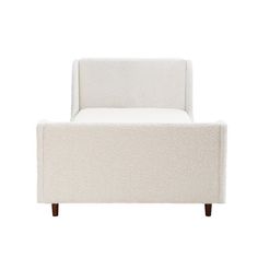 an upholstered white chair with wooden legs