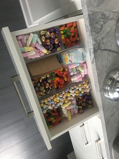 a cabinet filled with lots of candy and candies