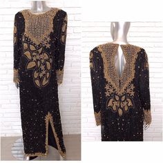 "Stunning black silk full length gown with black and gold beading. Made in almost a tunic style with round gold beads on the chest and sleeves. This dress is long to the floor, keyhole opening in the back, front split. In great condition all around. Made by the brand London, 100% pure silk, rayon lining, made in India, size medium. Shown on a size 6 , 5' 11\" mannequin, this dress is designed to fit relaxed and loosely. Size medium 25 inch sleeves 21 arm pit to arm 58 inches long 39 inch waist" Gold Embellished Long Sleeve Maxi Dress, Gold Bollywood Style Formal Dresses, Gold Embellished Maxi Dress For Gala, Bollywood Style Gold Evening Dress, Gold Bollywood Evening Dress, Traditional Embellished Evening Maxi Dress, Long Embroidered Evening Gown, Fitted Embellished Gold Maxi Dress, Gold Embellished Evening Gown