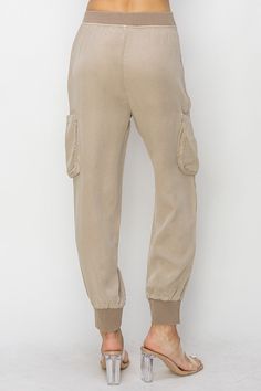 Discover the ultimate blend of style and comfort with our Taupe High Rise Haven Joggers. Designed to elevate your everyday look, these joggers are perfect for those who seek both fashion and functionality in their wardrobe. Key Features: High Rise Fit: Flattering and comfortable, these joggers sit perfectly at the waist, providing a sleek silhouette. Versatile Taupe Color: The neutral taupe shade makes these joggers easy to pair with any top, ensuring they become a staple in your closet. Premium Tercel Fabric: Crafted from high-quality tercel, these joggers offer a luxurious feel with exceptional durability. Cargo Pockets: Functional and stylish, the cargo pockets add a trendy touch while providing ample storage for your essentials. Elastic Waistband and Cuffs: The elastic waistband ensure Relaxed Fit Cargo Style Joggers For Loungewear, Athleisure Joggers With Pockets For Elevated Casual Occasions, Utility Relaxed Fit Joggers For Loungewear, Relaxed Fit Utility Joggers For Loungewear, Athleisure Joggers With Side Pockets For Elevated Casual Wear, Sporty Joggers With Pockets For Casual Wear, Elevated Casual Straight Leg Joggers With Pockets, Straight Leg Joggers With Pockets For Elevated Casual, Utility Joggers With Side Pockets For Loungewear