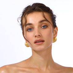 Discover the allure of our gold-plated seashell earrings, exquisitely crafted to capture the essence of the ocean's natural beauty. They feature delicate details and a lustrous finish, offering a timeless elegance that complements any outfit. Perfect for both casual and formal occasions, these earrings are a statement of sophisticated style and coastal charm. Handcrafted with 24k Gold plated brass Nickel, lead and cadmium free Earring pins are made of gold plated 925 silver which are non-allerge Gold Shell-shaped Earrings For Wedding, Gold Plated Shell-shaped Earrings, Elegant Round Beach Earrings, Elegant Gold Plated Shell Jewelry, Elegant Gold-tone Jewelry For Beach, Elegant Gold-tone Beach Jewelry, Elegant Shell-shaped Gold Hoop Earrings, Elegant Gold Shell Hoop Earrings, Elegant Round Hoop Earrings For The Beach