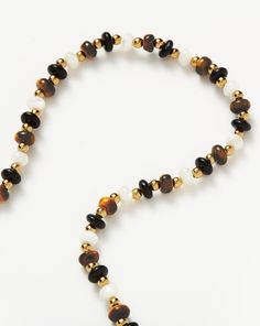 Savi Pearl & Gemstone Beaded Necklace | 18ct Gold Plated/Multi. Oval Mother of Pearl, Tiger's Eye and Black Onyx Gemstones Form this Beaded Necklace and are Offset with Small Gold Beads. Make a Neckmess by Pairing with Pendant Necklaces, Chunky Chains or the Matching Pearl & Gemstone Beaded Bracelet. A Collection Designed in Collaboration with the Beijing-Born Tastemaker Behind Savislook, Inspired by Architecture and Organic Forms. Metal: 18Ct Recycled Gold Plated on Brass Gemstones: Mother of P Elegant Round Spacer Beads, Yellow Gold Beaded Necklaces With Natural Stones, Gemstone Beaded Necklace, Gemstone Beaded Bracelets, Pearl Gemstone, Monogrammed Items, Conflict Free Diamonds, Gold Beads, Gold And Silver