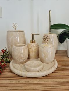 a bathroom set with soap dispenser, toothbrush holder and cups