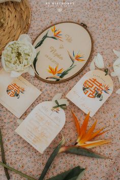 the wedding stationery is laid out with flowers, cards and other items for guests to use