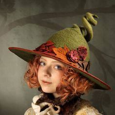 "A fancy witch hat encircled with Autumn leaves and flowers. The dimensions are approximately 15\" across and 10\" deep from brim to the top of the curly point. The point is reinforced with wire allowing you to position it however you like. The brim is bound in reddish brown Dupioni silk. You can order this hat in any color you like. There is no upcharge for a color change. How to measure your head: Use a soft measuring tape and measure around the middle of your forehead above the ears, and at t Green Witch Hat, Felt Witch Hat, Moldes Halloween, Autumn Witch, Nature Witch, Fairy Clothes, Dupioni Silk, Witch Costume, Fantasy Costumes