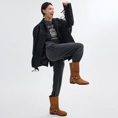 Ready to dress up or down our Tara Biker Boot adds an edgy touch to your look. Featuring polished ring hardware with stud detailing the pull-on velvety suede design is finished with a walkable stacked heel and rubber outsole. | Coach Tara Biker Boot - Women's Size 8 - Coconut Womens Biker Boots, Coach Boots, Lug Sole Boots, Branding Coach, Black Heel Boots, Lady Biker, Biker Boots, Stacked Heel, Boot Shoes Women