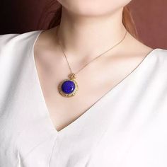 Material: S925 Sterling Silver with Gold PlatingGemstone: Lapis Lazuli, approximately 20mmWeight: Approximately 8.5gSize: Pendant Diameter: 28mm, Total Length: 36mm Description:This Lapis Lazuli Pendant Necklace showcases the captivating deep blue hue of a 20mm natural lapis lazuli gemstone, set in an intricately designed gold-plated S925 sterling silver frame. The ornate detailing around the pendant adds a vintage-inspired elegance, while the addition of colorful accent stones enhances its allure. The necklace's refined chain complements the pendant, creating a balanced, eye-catching piece. Perfect for adding a pop of color and a touch of sophistication to any outfit, this necklace is a must-have for lovers of unique and timeless jewelry. Note: The natural properties and composition of mi Formal Lapis Lazuli Pendant Necklace, Formal Lapis Lazuli Pendant Jewelry, Lapis Lazuli Round Pendant Jewelry Gift, Lapis Lazuli Pendant In Yellow Gold, Luxury Faceted Lapis Lazuli Necklaces, Lapis Lazuli Gemstone, Lapis Lazuli Pendant, Natural Stones Necklace, Pearl Jewelry Necklace