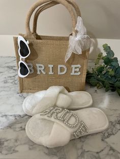 the bride slippers are next to a bag