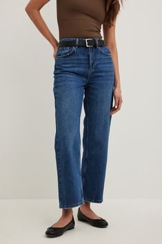 These jeans are stretchy and feature a straight fit. They have a high waist and cropped length. These jeans feature a five-pocket design. Inseam Length in Size 36: 69 cm / 27 in. Waist in Size 36: 35 cm / 13.77 in. Seat in Size 36: 48 cm / 18.89 in. Trendy Blue Straight Cropped Jeans, Blue Straight Leg Cropped Jeans, Blue Cropped Straight Leg Jeans With Five Pockets, Trendy Blue Cropped Jeans With Straight Hem, Blue Straight Fit Cropped Jeans, Jeans Midsize, Straight Wide Leg Jeans, Style Must Haves, Straight Leg Blue Jeans