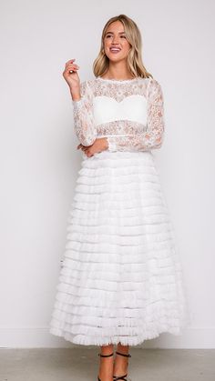 Experience the magic and allure of our Olivia Layered White Lace Tulle Dress, where timeless elegance meets modern romance. Whether you're walking down the aisle, attending a formal event, or celebrating a special occasion, this dress will make you feel like the epitome of grace and beauty. 78747 D8-2 Lace Sleeve Fitted Bodice Dress For Prom, Fitted Bodice Dress With Lace Sleeves For Prom Season, Lace Sleeves Fitted Bodice Dress For Prom Season, Elegant Gown With Lace Bodice For Prom, Prom Season Dress With Lace Sleeves And Fitted Bodice, Elegant Prom Gown With Lace Bodice, Elegant Gown With Sheer Lace Bodice, Elegant Lace Gown With Sheer Bodice, Elegant Bridesmaid Gown With Illusion Neckline