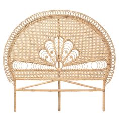 a wicker headboard with an intricate design on the top and bottom part,