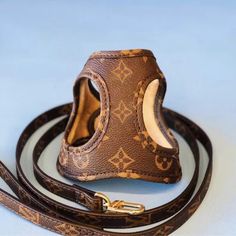 a brown leather dog leash with an animal's head on it