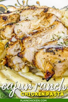 chicken and pasta on a plate with the words cajun ranch