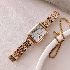 Enhance your elegance with this luxurious gold-plated women's watch featuring a sleek rectangular dial adorned with classic Roman numerals. Perfect for any occasion, this timeless piece combines vintage charm with modern sophistication. The high-quality craftsmanship ensures durability while the adjustable gold link bracelet provides a comfortable fit. Whether as a treat for yourself or a gift for a loved one, this watch is a statement of refined style and grace. Technical specifications: ➡ Move