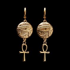 "Treat yourself or a loved one to these beautifully made earrings. The earrings are 1 3/8\" long (4.4cm). They are made of 24K gold plated brass and are expensive-looking. Choose the earrings quantity (single - 1 earring or a pair - 2 earrings) from the drop-down menu when you add items to the cart. For more of the Egypt theme jewelry: https://www.etsy.com/ca/shop/LeafOnWaterStudio?search_query=Egypt  You will receive your earrings carefully packed and ready to gift. I will include a message by request  ★ See all of our items at https://www.etsy.com/ca/shop/LeafOnWaterStudio ★ The sold jewelry is not made of solid gold and is only gold plated. To extend the life of your jewelry please keep it away from water and chemicals ★" Egyptian Style Jewelry, Symbolic Metal Jewelry With Matching Earrings, Symbolic Teardrop Jewelry With Matching Earrings, Symbolic Metal Dangle Earrings, Symbolic Dangle Jewelry With Ear Wire, Symbolic Drop Earrings With Ear Wire, Nickel-free Ankh Earrings As Gift, Nickel Free Ankh Earrings For Gift, Symbolic Dangle Plug Earrings For Pierced Ears