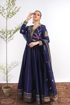 A royal blue frock in raw silk with embroidery on the bodice and a matching net dupatta with kiran along its width. Finished with a jamawar trouser for a regal touch.3-piece suitReady to wear Unstitched Anarkali Dress With Dupatta, Blue Dresses With Resham Embroidery In Cotton Silk, Anarkali Raw Silk Gown With Dabka Detail, Anarkali Cotton Silk Dress With Sheer Dupatta, Anarkali Chanderi Dress With Sheer Dupatta, Semi-stitched Royal Blue Bollywood Anarkali Set, Blue Embroidered Cotton Silk Dress, Bollywood Style Saree Set In Royal Blue, Embroidered Cotton Silk Floor-length Dress