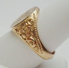 This is a really pretty signet ring from the Art Nouveau period. The ring has an oval signet area that measures 16 x 14 mm. The signet is already hand engraved with a monogram. The sides of the ring has a lovely carved floral design with a beaded edge. This ring is a nice size for either a man or a woman. The ring is stamped 14K and weighs 12.0 grams. The ring is engraved inside M B to P F. The ring is a size 10. *Sizing is available. Please message us for a quote* *We are always willing to ship Luxury Antique Signet Ring With Single Cut Diamonds, Luxury Antique Engraved Filigree Ring, Luxury Traditional Carved Rings, Luxury Antique Signet Ring Stamped 925, Luxury Victorian Engraved Yellow Gold Ring, Luxury Vintage Signet Ring With Engraving Option, Luxury Silver Art Deco Signet Ring, Luxury Vintage Signet Ring With Hallmarks, Luxury Vintage Signet Ring With Polished Finish