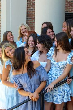 a group of young women standing next to each other