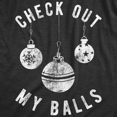 a black shirt that says check out my balls with ornaments hanging from the front and back