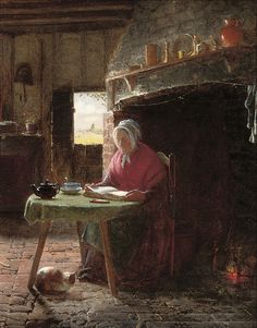 an old woman sitting at a table in front of a fire place with a dog