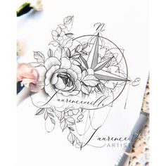 a drawing with flowers and compass on it