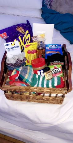 a basket filled with food on top of a bed