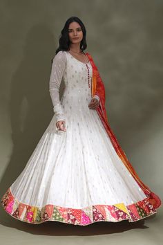 Dance the night away at sangeet and weddings in this beautiful white floorlength Anarkali suit with multicolor border. It comes with a multicolor bandhej dupatta. Shop designer suits in USA from Pure Elegance. Disclaimer: The actual product may vary slightly from the image. These are custom orders, hence expect slight variation in color, placement of the motif or buta. ESTIMATED DELIVERY: Because this is a custom order, it would take about 4 weeks from the date of purchase. RETURN POLICY: This product is a custom order and cannot be returned or exchanged. Suits Sharara, Bandhej Dupatta, Anarkali Suits Designer, White Anarkali, Sharara Suits, Designer Lehengas, Pure Elegance, Fashion Journals, Dresses Designer