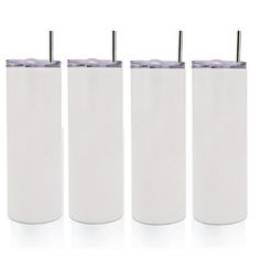 three white tumblers with straws in them