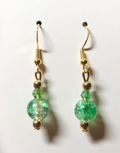 Gold plated findings. green beads. hypoallergenic materials. Lightweight. Green Beaded Dangle Teardrop Earrings, Green Beaded Teardrop Jewelry, Green Dangle Earrings For Pierced Ears, Elegant Green Hypoallergenic Beaded Earrings, Handmade Green Elegant Clip-on Earrings, Elegant Green Dangle Beaded Earrings, Green Teardrop Beaded Earrings With Dangling Beads, Nickel-free Green Drop Earrings, Green Teardrop Beaded Earrings For Party