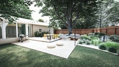 an outdoor patio with seating and trees in the back yard, surrounded by greenery