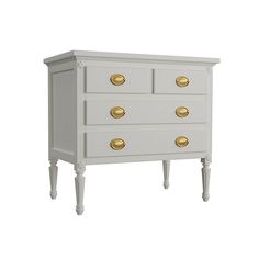 a white dresser with gold knobs on the drawers