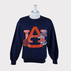 Vintage 90s Auburn Tigers (Auburn University) Football/Basketball NCAA Sweatshirt 💯 SATISFACTION AND AUTHENTICITY ⭐ MEASUREMENTS (when laid flat) Size on Tag: M Length: 68cm or 27 inches Armpit to armpit: 52cm or 20.5 inches ⭐ CONDITION 9/10 (Very good) Details: No holes Material: Cotton Color: Dark Blue Navy Brand: Russell Athletic 🔷 Please give us your phone no. together with address after you purchased. 🔷Please keep in mind that our items are vintage so they may show some signs of wear and Throwback Long Sleeve T-shirt For College, Collegiate Winter T-shirt For Streetwear, Throwback Cotton Sweatshirt With Graphic Print, Throwback Logo Print Sweatshirt For Fall, Fall Throwback Logo Print Sweatshirt, Vintage Cotton Sweatshirt For Game Day, Throwback College Sweatshirt With Relaxed Fit, Throwback College Sweatshirt In Relaxed Fit, Throwback Relaxed Fit College Sweatshirt