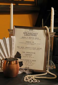 a table topped with candles and a menu