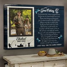 an old dresser with a plaque on it that says gone fishing, and the image of a fisherman holding a fish