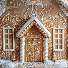 a gingerbread house is decorated with icing