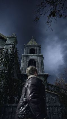 a man standing in front of a tall building