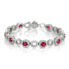 Eleven oval shaped red rubies weighing 4.58 carats on a bracelet.These rubies are from Mozambique and has a mixed brilliant cut and vivid color intenisty.Also featured in the bracelet are 242 round shaped white diamonds weighing 3.26 carats. #braceletfashion #fallbracelets #amazingjewelry #iloveyourbracelet #diyjewelryideas Red Oval Diamond Gemstone Bracelet, Red Oval Diamond Bracelet, Red Diamond Oval Bracelet, Elegant Red Oval Diamond Bracelet, Luxury Red Oval Bracelet, Elegant Red Oval Bracelets, Red Diamond Oval Tennis Bracelet, Elegant Red Bracelets With Brilliant Cut, Ruby Bracelets