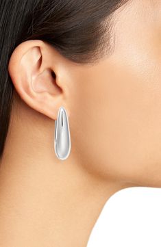 Perfect for the work day and beyond, these oval teardrop hoop earrings offer molten shine with a glossy goldtone or rhodium-plated finish. 1 1/2" hoop diameter Hinge with snap-post closure Goldtone plate or rhodium plate Imported Teardrop Hoop Earrings, Oval Hoop Earrings, Fabric Gift Bags, Keep Jewelry, Fabric Gifts, Free Fabric, Print Gifts, Rhodium Plated, Gold Tones