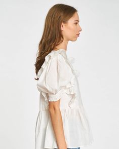 The Eyelet Puff Sleeve Top with its peplum hem and cascading ruffle detail to offset subtle princess sleeves, also features eyelet lace insets, creating a beautiful boho effect. This blouse is the quintessential springtime silhouette, and pairs well with your favorite jeans! Feminine Fitted Puff Sleeve Top With Ruffle Hem, Voluminous Tops For Spring Daywear, Feminine Puff Sleeve Top With Ruffle Hem, Feminine Puff Sleeve Top With Ruffle Hem For Brunch, Elegant Spring Puff Sleeve Top With Ruffle Hem, Elegant Puff Sleeve Top With Ruffle Hem For Spring, Spring Puff Sleeve Top With Ruffle Hem, Chic Puff Sleeve Top With Ruffle Sleeves, Chic Peplum Top With Puff Sleeves And Ruffle Hem