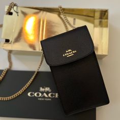 Coach Black Crossbody Bag With Gold Strap. Brand New! Snap Closure. Style F89282. Strap With 33” Drop Wear As A Crossbody Or A Shoulder Bag. 4 1/4” Long X 7” High X 1 1/4 Width. Comes With Coach Gift Box. All Sales Are Final. Elegant Everyday Phone Bag With Chain Strap, Chic Black Phone Bag Gift, Chic Black Phone Bag For Gift, Chic Black Phone Bag As Gift, Elegant Black Phone Bag Gift, Coach Rectangular Wallet On Chain For Evening, Coach Classic Rectangular Wallet On Chain, Classic Coach Wallet On Chain, Chic Coach Rectangular Wallet On Chain