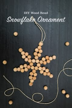 a wooden bead snowflake ornament on a black background