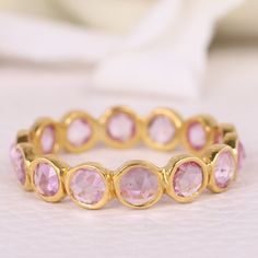 Pink Sapphire Full Eternity Band, September Birthstone Pink Sapphire Band , Sapphire Stacking ring, Wedding band, Anniversary Gift For Her [{"Description"}] Main Gemstone- Name- Pink Sapphire (Lab Created) Shape - Round Stone Color - Pink Birthstone- September Add this beautiful Ring in your accessories to make you feel unique.  You can select any size you want from drop down menu.  We Accept Custom Order and Bulk Order Also, Feel free to contact me for any queries regarding custom or bulk order Faceted Sapphire Ring For Anniversary, Stackable Crystal Ring For Wedding With Round Band, Stackable Crystal Wedding Ring With Round Band, Elegant Faceted Stackable Rings For Wedding, Fine Jewelry Stackable Round Rings For Wedding, Round Gemstone Eternity Band For Anniversary, Stackable Crystal Ring For Anniversary, Yellow Gold Faceted Crystal Wedding Ring, Gold Faceted Stackable Wedding Rings