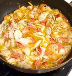 a pan filled with food sitting on top of a stove