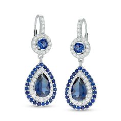 Give her a reason to dress up with these dazzling fashion drop earrings. Crafted in sterling silver, each earring features a dangle centered with a 9.0 x 6.0mm pear-shaped lab-created bright blue sapphire. Frames of lab-created white and blue sapphires wrap the center stone in a sparkling embrace. Above, a round blue sapphire is framed with a halo of white sapphires, while additional white sapphires line the fronts of the lever back closures. Buffed to a brilliant luster, these earrings are the Luxury Blue Pear-shaped Earrings, Fine Jewelry Sapphire Drop Earrings, Sapphire Drop Earrings In Fine Jewelry, Sapphire Drop Earrings Fine Jewelry, Elegant Sapphire Drop Jewelry, Luxury Sterling Silver Pear-shaped Earrings, Sapphire Pear-shaped Earrings Fine Jewelry, Luxury Pear-shaped Sterling Silver Earrings, Elegant Blue Diamond Dangle Earrings