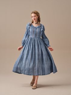 "This ruffled linen midi dress is full of romance and whimsy. This stunning linen dress in MidnightBlue uses ancient tie-dye techniques to create a unique gradient effect that gently unfolds into a cloud-like pattern. It's sure to turn heads! Flattering ruffles paired with soft pintucks add an elegant feminine touch and speaks to romantic nights dancing under a star studded sky or long lunches in the garden with friends.  Carefully crafted cutout details at the front and back create a mysterious and alluring atmosphere. Whether you choose a classic and timeless white dress or a bold and vibrant MidnightBlue hue, you'll fall in love. Note: No two patterns are alike, due to the nature of the hand-dyeing process. 【Fabric】 Main: 100% linen, around 200g/gram. Medium weight. Lace: 100% cotton. a Cottagecore Midi Dress With Ruffles, Flowy Long Sleeve Cottagecore Dress, Cottagecore Maxi Dress With Ruffles, Bohemian Linen Dress With Ruffles, Elegant Spring Prairie Dress For Gatherings, Bohemian Linen Maxi Dress With Ruffles, Elegant Ruffled Midi Dress For Gatherings, Ruffled Midi Prairie Dress For Daywear, Elegant Midi Linen Dress With Ruffles