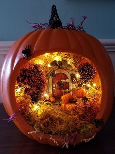 a pumpkin decorated with lights and decorations