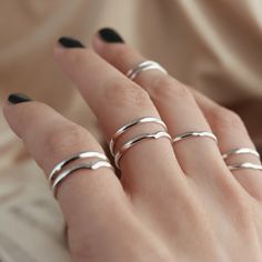 Our sterling silver delicate plain band ring is a simple essential addition to your stack. This features a very gentle dipped wishbone shape. MaterialSterling Silver SizingRing Front - 2mm Solid Color Adjustable Minimalist Jewelry, Minimalist Stackable Double Band Midi Rings, Simple Silver Stackable Rings For Everyday, Silver Minimalist Bands For Gift, Simple Stackable Midi Rings With Open Band, Dainty Silver Stackable Rings With Open Band, Silver Midi Rings With Simple Design, Minimalist Open Band Gift Bands, Simple White Gold Stackable Rings