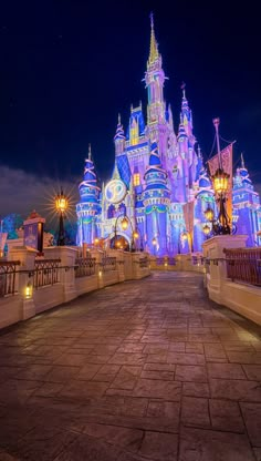 a castle lit up at night with lights on it