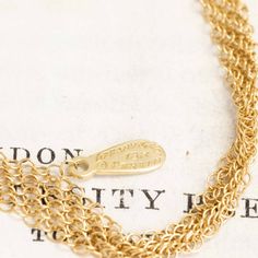 One of the most unique chains from designer Elsa Peretti, a sinuous and luscious mesh of 18kt yellow gold crafted so intricately that is lays and moves like silk. Perfect to wear as-is, or even wear doubled up. Maybe also be strung around a pendant (maybe the open heart pendant?).A wonderful collector's piece. 18kt yellow gold 30" in length 11.2 grams Please see qualitative report for more information. Elegant Double Chain Brass Necklace, Elegant Brass Double Chain Necklace, Elegant Brass Necklace With Double Chain, Yellow Gold Brass Jewelry With Double Chain, Yellow Gold Double Chain Brass Jewelry, Double Chain Brass Necklace As A Gift, Brass Double Chain Necklace For Gift, Gift Brass Double Chain Necklace, Elegant Multi-strand Brass Jewelry