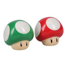 two nintendo mushroom figurines sitting next to each other